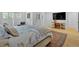 This comfortable main bedroom has neutral tones, hardwood floors, and shuttered windows at 400 Old Ivy Ne Rd, Atlanta, GA 30342