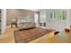 Spacious main bedroom with hardwood floors, shutters, and a large rug at 400 Old Ivy Ne Rd, Atlanta, GA 30342