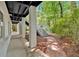 Covered patio with brick columns and a brick pathway leading to the backyard at 400 Old Ivy Ne Rd, Atlanta, GA 30342