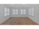 Neutral room with ceramic tile, two large windows, and blinds at 400 Old Ivy Ne Rd, Atlanta, GA 30342