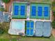 Aerial view showcasing community amenities: tennis courts, pickleball courts, and a refreshing swimming pool at 5844 Brookstone Nw Walk, Acworth, GA 30101