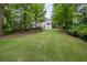 Secluded backyard with mature trees offers privacy and a tranquil setting at 5844 Brookstone Nw Walk, Acworth, GA 30101