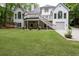 Picturesque backyard featuring lush greenery, a patio, and deck, ideal for relaxation and gatherings at 5844 Brookstone Nw Walk, Acworth, GA 30101