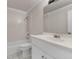 Bright bathroom with a white vanity, tile flooring, and a shower-tub combo at 5844 Brookstone Nw Walk, Acworth, GA 30101