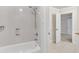 Bright bathroom featuring a shower-tub combo and neutral finishes at 5844 Brookstone Nw Walk, Acworth, GA 30101