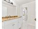 Bathroom with white cabinets, granite countertops, and a shower/tub combo at 5844 Brookstone Nw Walk, Acworth, GA 30101