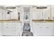 Dual sink bathroom with stone countertops, walk-in shower, and access to backyard at 5844 Brookstone Nw Walk, Acworth, GA 30101