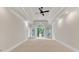 Primary bedroom with tray ceiling, recessed lighting and a wall of windows at 5844 Brookstone Nw Walk, Acworth, GA 30101