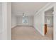 Spacious bedroom with neutral carpet and crown molding, complemented by a ceiling fan and ample natural light from a window at 5844 Brookstone Nw Walk, Acworth, GA 30101