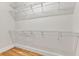 Walk-in closet featuring metal shelving and wooden floor at 5844 Brookstone Nw Walk, Acworth, GA 30101