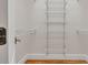 Walk-in closet featuring metal shelving and wooden floor at 5844 Brookstone Nw Walk, Acworth, GA 30101