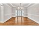 Formal dining room featuring hardwood floors, large windows, and elegant chandelier lighting at 5844 Brookstone Nw Walk, Acworth, GA 30101