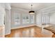 Well-lit dining room with hardwood floors, elegant trim, and views to adjacent rooms at 5844 Brookstone Nw Walk, Acworth, GA 30101