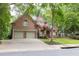 Charming brick home features a two-car garage, lush landscaping, and a welcoming front entrance at 5844 Brookstone Nw Walk, Acworth, GA 30101