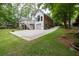 Exterior back view shows deck, lawn, patio and driveway for parking at 5844 Brookstone Nw Walk, Acworth, GA 30101