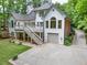 Charming exterior of a two-story home featuring a garage and a well-maintained driveway and lawn at 5844 Brookstone Nw Walk, Acworth, GA 30101