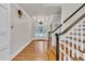 Bright foyer with hardwood floors, paneled walls, and an ornate front door with decorative glass at 5844 Brookstone Nw Walk, Acworth, GA 30101