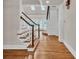 Welcoming foyer with hardwood floors, skylights, and staircase with wood railing and white risers at 5844 Brookstone Nw Walk, Acworth, GA 30101