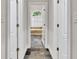 Hallway view of bedroom with soaking tub under arch window at 5844 Brookstone Nw Walk, Acworth, GA 30101