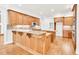 Gourmet kitchen with custom wood cabinets, granite countertops, and hardwood floors at 5844 Brookstone Nw Walk, Acworth, GA 30101