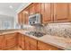 Kitchen with stainless appliances, granite countertops, tile backsplash and custom cabinetry at 5844 Brookstone Nw Walk, Acworth, GA 30101
