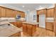Kitchen with an island, stainless steel appliances, and custom cabinetry at 5844 Brookstone Nw Walk, Acworth, GA 30101