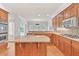 Gourmet kitchen with granite counters, island, stainless steel appliances, and ample cabinet space at 5844 Brookstone Nw Walk, Acworth, GA 30101