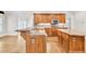 Spacious kitchen with granite countertops, stainless steel appliances, and hardwood floors at 5844 Brookstone Nw Walk, Acworth, GA 30101