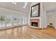 Vaulted living room with skylights, fireplace, and French doors to a patio at 5844 Brookstone Nw Walk, Acworth, GA 30101
