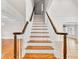 Beautiful staircase featuring hardwood steps and white railing at 5844 Brookstone Nw Walk, Acworth, GA 30101
