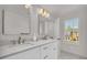 Bright bathroom features double sinks, marble countertops, and natural light at 1 N Boundary Nw Pl, Atlanta, GA 30318