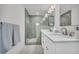 Contemporary bathroom with double sinks and a glass-enclosed shower at 1 N Boundary Nw Pl, Atlanta, GA 30318