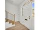 Welcoming entryway with staircase, light-colored floors, and a bright front door at 1 N Boundary Nw Pl, Atlanta, GA 30318