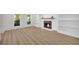 Bright living room with wood flooring, a fireplace, and built-in shelving at 1 N Boundary Nw Pl, Atlanta, GA 30318