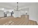 Open floor plan with modern kitchen and dining area featuring new floors at 1 N Boundary Nw Pl, Atlanta, GA 30318