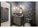 Chic powder room with designer wallpaper, vessel sink, pendant lights, and modern toilet at 2067 Telfair Circle # A&B, Atlanta, GA 30324