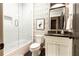 Chic bathroom with stylish wallpaper, a modern vanity, and a shower-tub combo, exuding contemporary elegance at 2067 Telfair Circle # A&B, Atlanta, GA 30324