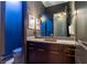 Elegant powder room with modern vanity, stylish lighting, and bold wall decor at 2067 Telfair Circle # A&B, Atlanta, GA 30324