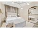 Bright bedroom featuring a large mirror, modern lighting, neutral color palette, and a comfortable upholstered bed at 2067 Telfair Circle # A&B, Atlanta, GA 30324