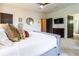 Comfortable bedroom featuring plush bedding, a ceiling fan, and dark doors for an elegant contrast at 2067 Telfair Circle # A&B, Atlanta, GA 30324