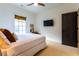 Well-lit bedroom featuring soft carpet, a large window, and minimalist decor creating a tranquil retreat at 2067 Telfair Circle # A&B, Atlanta, GA 30324