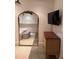 Bedroom with a large mirror, dresser, and mounted TV; flooded with natural light and neutral tones at 2067 Telfair Circle # A&B, Atlanta, GA 30324