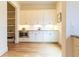 Well-appointed butler's pantry boasts built-in cabinets, stainless steel microwave, and ample counter space at 2067 Telfair Circle # A&B, Atlanta, GA 30324