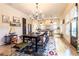 Open dining room with modern light fixtures, a view to the kitchen, and hardwood floors at 2067 Telfair Circle # A&B, Atlanta, GA 30324