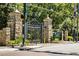 Entrance to Piedmont Park with stone pillars, iron gates, and lush greenery at 2067 Telfair Circle # A&B, Atlanta, GA 30324