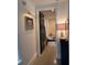 Hallway view to living room featuring stylish wall decor and neutral color palette at 2067 Telfair Circle # A&B, Atlanta, GA 30324