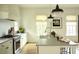 Bright kitchen featuring subway tile backsplash, modern appliances, and a functional island, ideal for cooking at 2067 Telfair Circle # A&B, Atlanta, GA 30324
