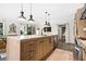 Open kitchen with a large island, stainless steel appliances, and modern fixtures at 2067 Telfair Circle # A&B, Atlanta, GA 30324