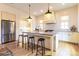 Modern kitchen showcasing a center island with bar stools, stainless steel fridge, and white cabinetry at 2067 Telfair Circle # A&B, Atlanta, GA 30324