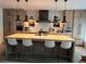 Bright kitchen with updated appliances, a large island with bar stool seating, and pendant lighting at 2067 Telfair Circle # A&B, Atlanta, GA 30324
